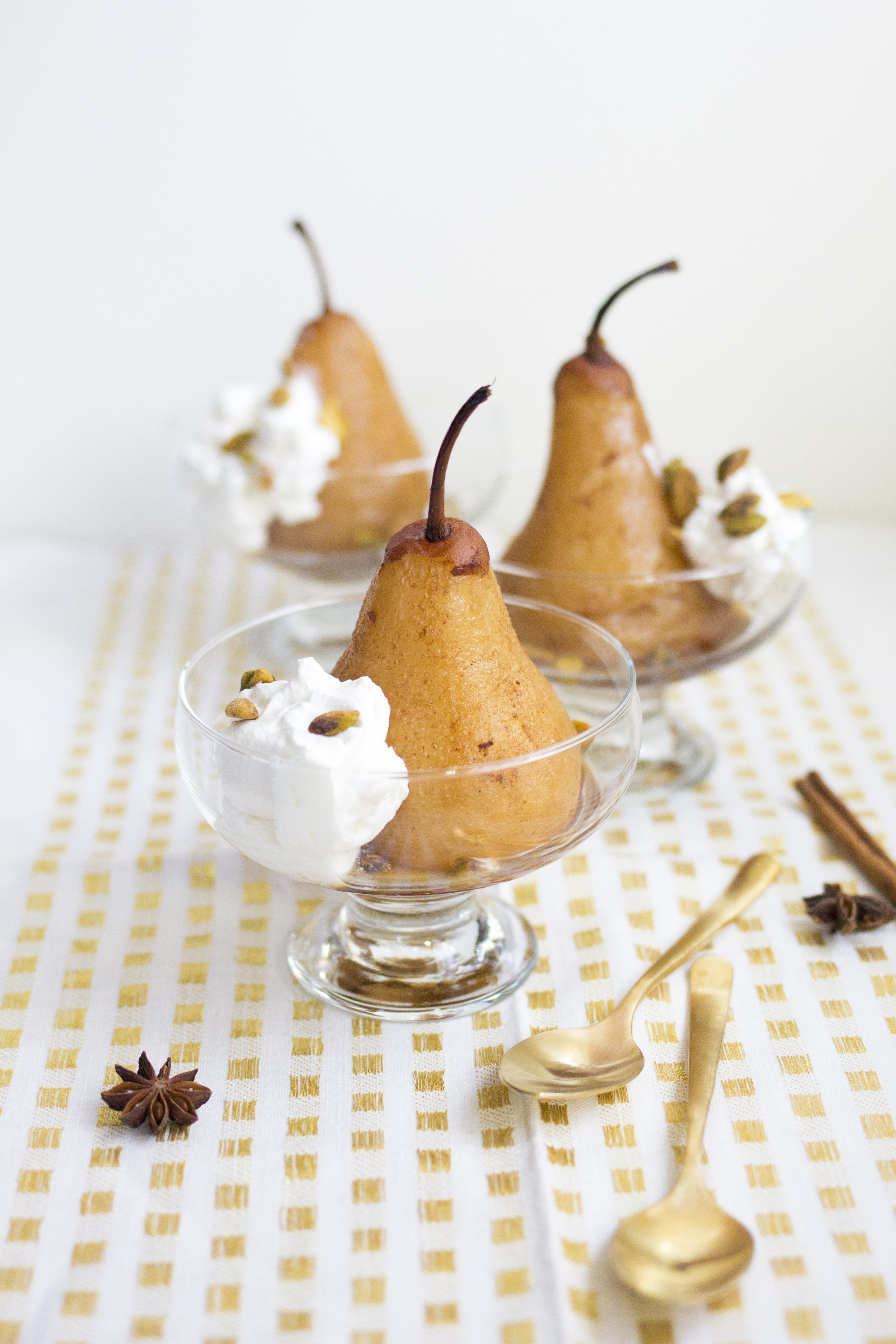 Chai Poached Pears with Whipped Cream and Pistachios