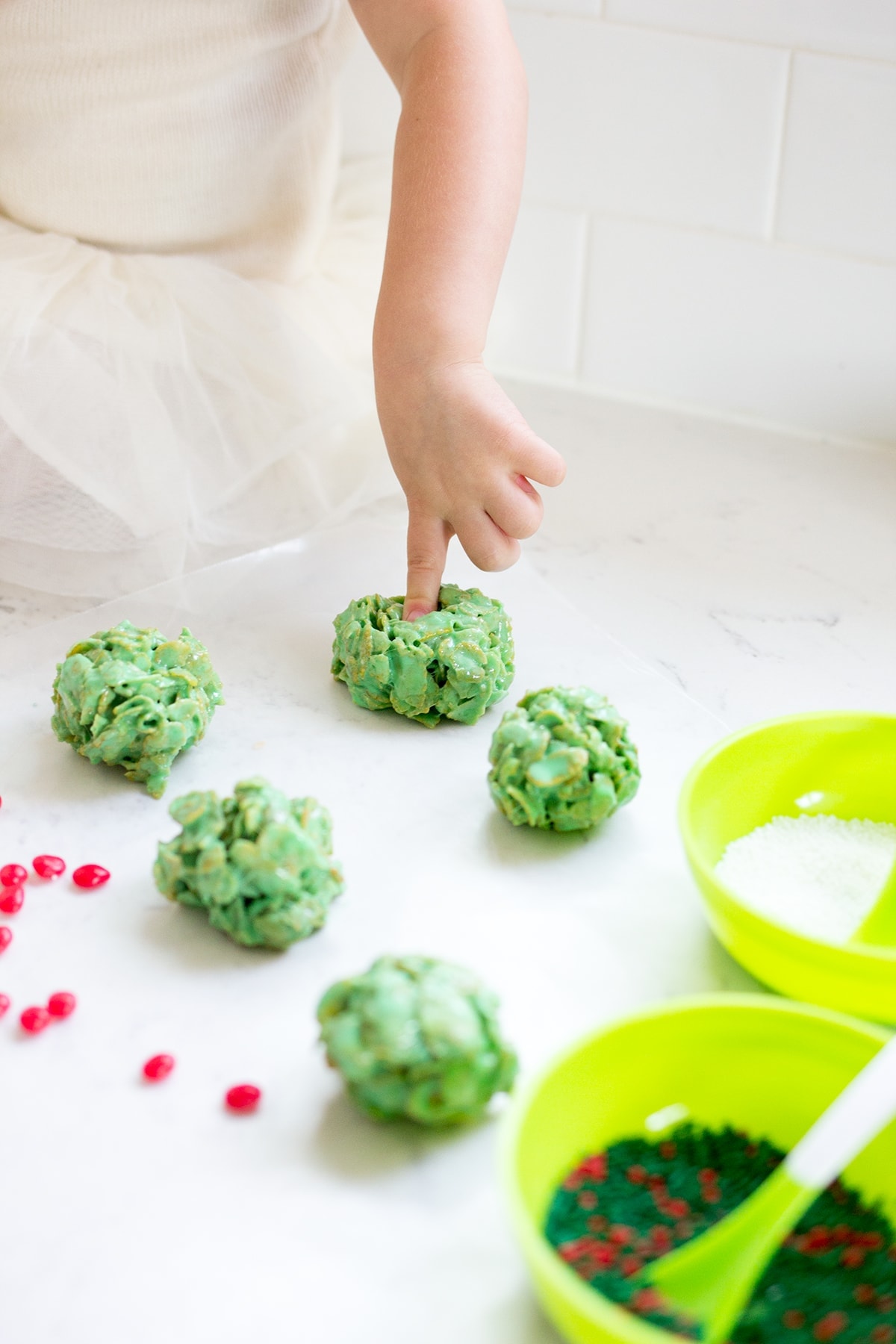 Classic Christmas Wreath Cookies, also known as holly wreath cookies, made with corn flakes and cinnamon candies are perfect for making with kids and leaving out for Santa on Christmas Eve.