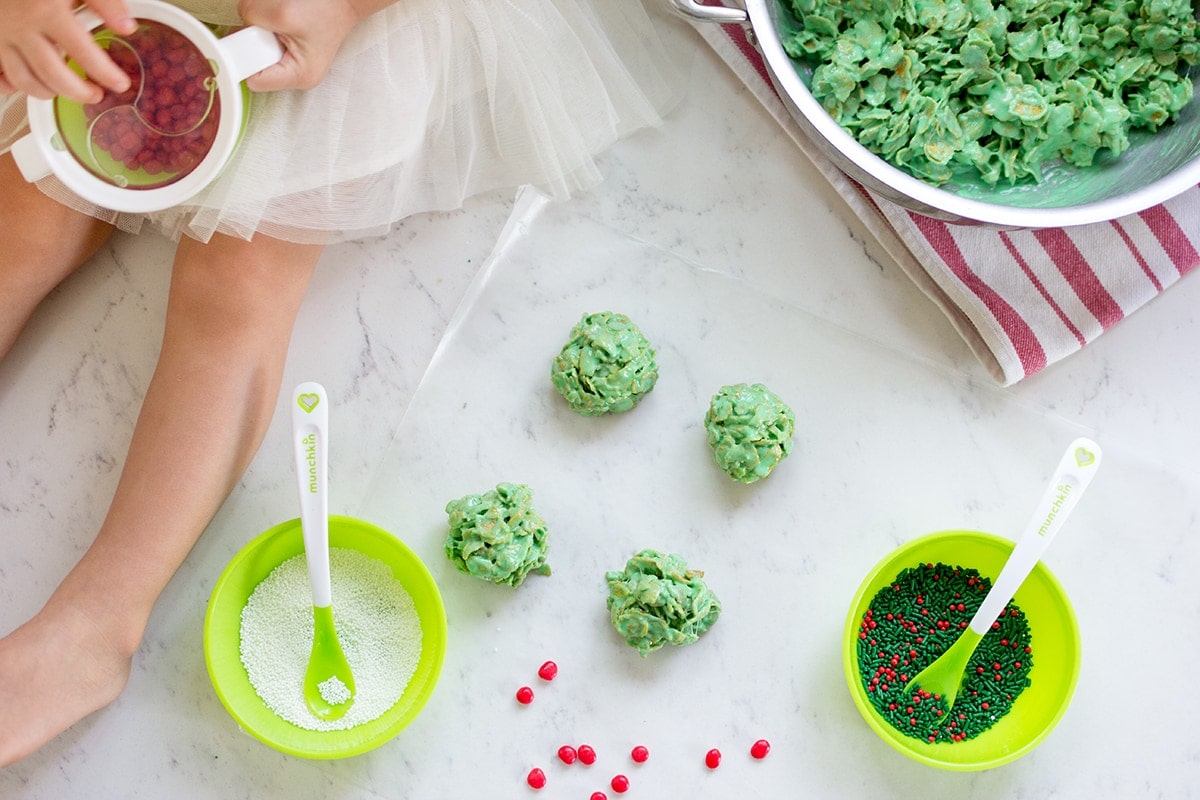 Classic Christmas Wreath Cookies, also known as holly wreath cookies, made with corn flakes and cinnamon candies are perfect for making with kids and leaving out for Santa on Christmas Eve.