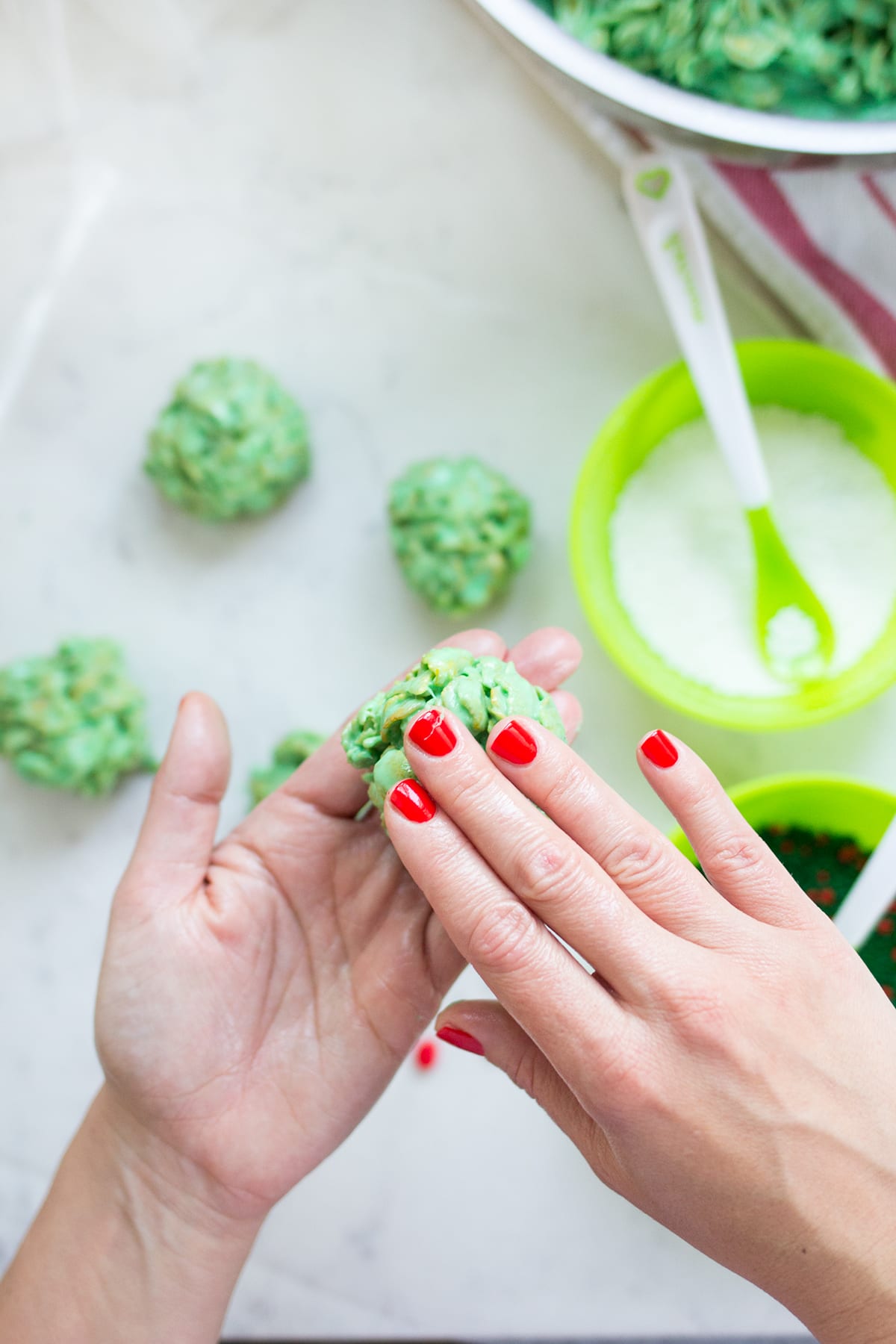 Classic Christmas Wreath Cookies, also known as holly wreath cookies, made with corn flakes and cinnamon candies are perfect for making with kids and leaving out for Santa on Christmas Eve.