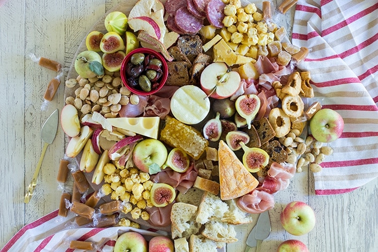 Fall Harvest Apple Inspired Cheese Board is a great party appetizer board to enjoy with friends and a bottle of crisp hard apple cider. I’m sharing all of my easy fall cheese board display ideas and Trader Joe’s ingredient list. #cheeseboardIdeas #DIYcheeseboard #cheeseboarddisplay #cheeseboardrecipes #easycheeseboard #traderjoes #fall #holiday #howtomakea #wooden #fall #harvest #apple #cheeseboard #traderjoescheeseboard #fallcheeseboard 