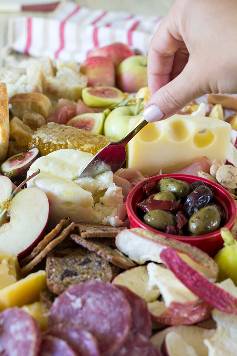 Fall Harvest Apple Inspired Cheese Board is a great party appetizer board to enjoy with friends and a bottle of crisp hard apple cider. I’m sharing all of my easy fall cheese board display ideas and Trader Joe’s ingredient list. #cheeseboardIdeas #DIYcheeseboard #cheeseboarddisplay #cheeseboardrecipes #easycheeseboard #traderjoes #fall #holiday #howtomakea #wooden #fall #harvest #apple #cheeseboard #traderjoescheeseboard #fallcheeseboard 