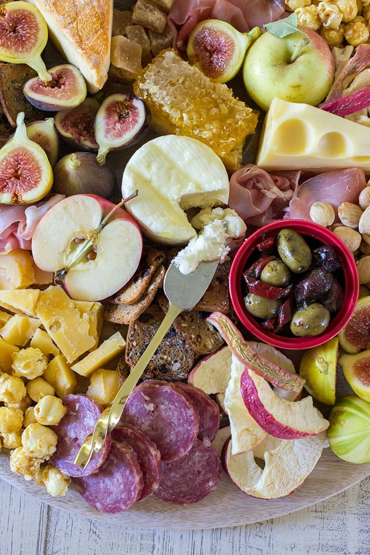 Fall Harvest Apple Inspired Cheese Board is a great party appetizer board to enjoy with friends and a bottle of crisp hard apple cider. I’m sharing all of my easy fall cheese board display ideas and Trader Joe’s ingredient list. #cheeseboardIdeas #DIYcheeseboard #cheeseboarddisplay #cheeseboardrecipes #easycheeseboard #traderjoes #fall #holiday #howtomakea #wooden #fall #harvest #apple #cheeseboard #traderjoescheeseboard #fallcheeseboard 