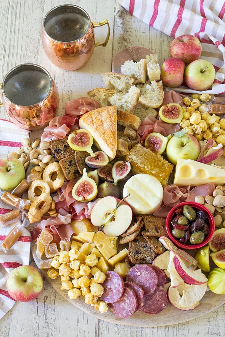 Fall Harvest Apple Inspired Cheese Board is a great party appetizer board to enjoy with friends and a bottle of crisp hard apple cider. I’m sharing all of my easy fall cheese board display ideas and Trader Joe’s ingredient list. #cheeseboardIdeas #DIYcheeseboard #cheeseboarddisplay #cheeseboardrecipes #easycheeseboard #traderjoes #fall #holiday #howtomakea #wooden #fall #harvest #apple #cheeseboard #traderjoescheeseboard #fallcheeseboard 