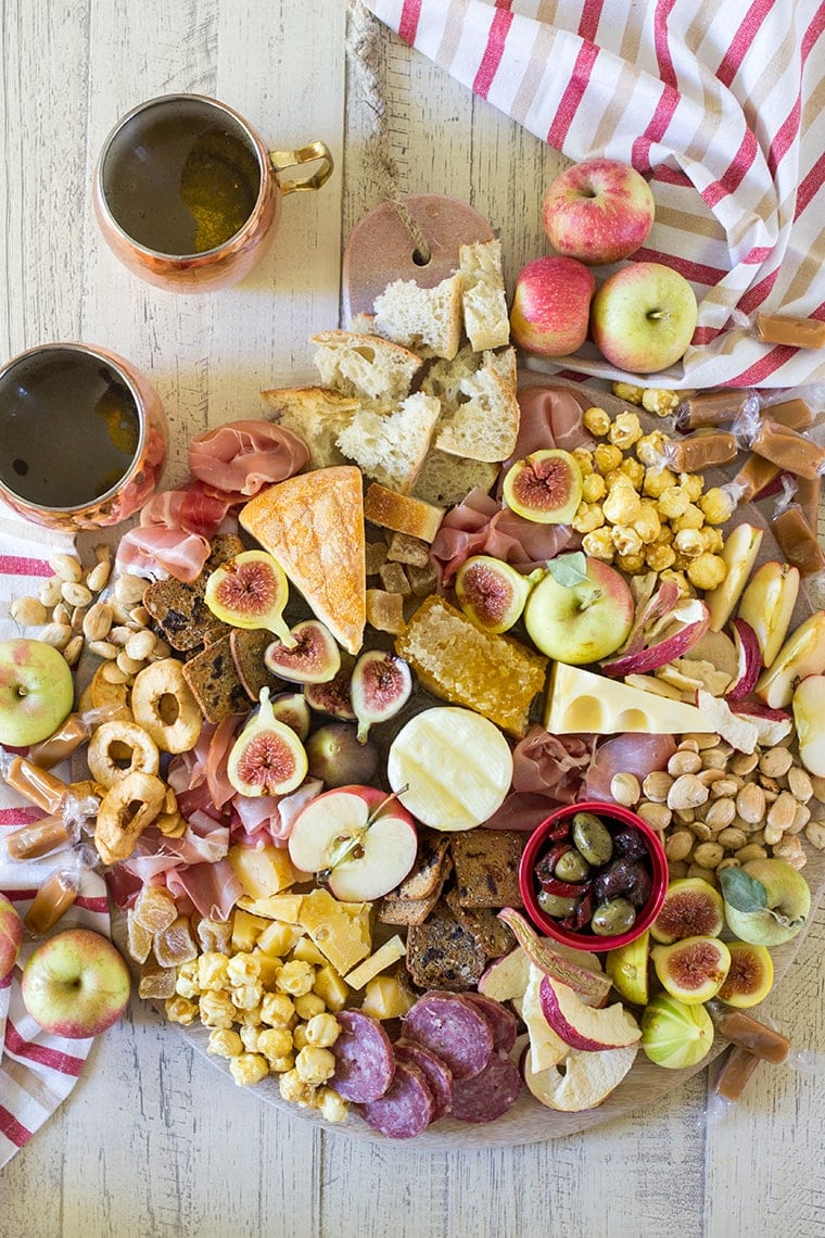 Fall Harvest Apple Inspired Cheese Board is a great party appetizer board to enjoy with friends and a bottle of crisp hard apple cider. I’m sharing all of my easy fall cheese board display ideas and Trader Joe’s ingredient list. #cheeseboardIdeas #DIYcheeseboard #cheeseboarddisplay #cheeseboardrecipes #easycheeseboard #traderjoes #fall #holiday #howtomakea #wooden #fall #harvest #apple #cheeseboard #traderjoescheeseboard #fallcheeseboard 