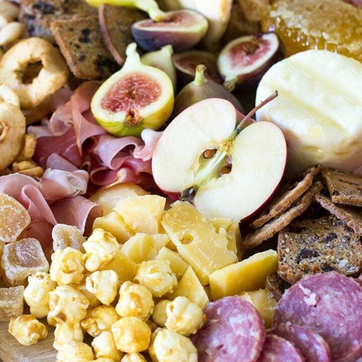 Fall Harvest Apple Inspired Cheese Board is a great party appetizer board to enjoy with friends and a bottle of crisp hard apple cider. I’m sharing all of my easy fall cheese board display ideas and Trader Joe’s ingredient list. #cheeseboardIdeas #DIYcheeseboard #cheeseboarddisplay #cheeseboardrecipes #easycheeseboard #traderjoes #fall #holiday #howtomakea #wooden #fall #harvest #apple #cheeseboard #traderjoescheeseboard #fallcheeseboard