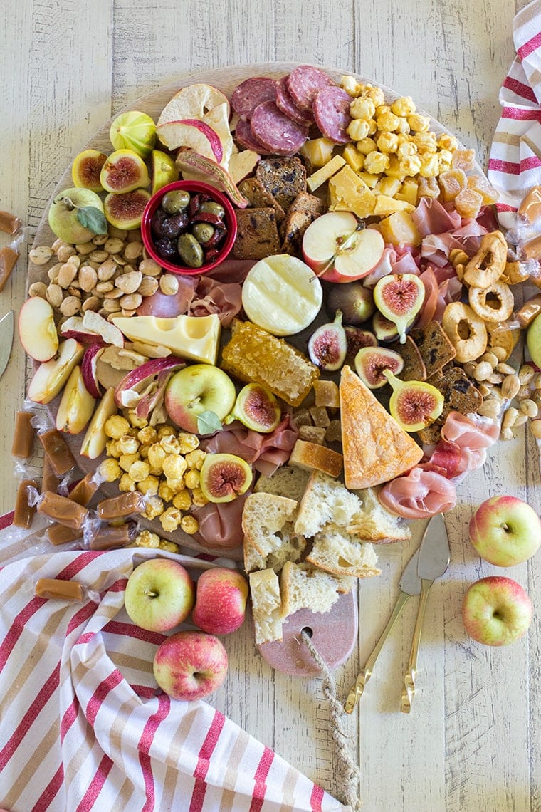 Fall Harvest Apple Inspired Cheese Board is a great party appetizer board to enjoy with friends and a bottle of crisp hard apple cider. I’m sharing all of my easy fall cheese board display ideas and Trader Joe’s ingredient list. #cheeseboardIdeas #DIYcheeseboard #cheeseboarddisplay #cheeseboardrecipes #easycheeseboard #traderjoes #fall #holiday #howtomakea #wooden #fall #harvest #apple #cheeseboard #traderjoescheeseboard #fallcheeseboard 