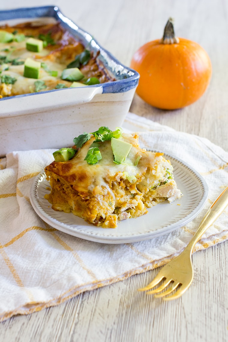 Pumpkin Chicken Enchiladas with a Pumpkin Enchilada Sauce make an easy and delicious family weeknight or weekend dinner perfect for fall. #enchiladas #pumpkin #chickenenchiladas #pumpkinenchiladas #enchiladasauce #glutenfree #glutenfreeenchiladas #pumpkinspice #dinner #weeknightdinner #easydinner #rotisseriechicken