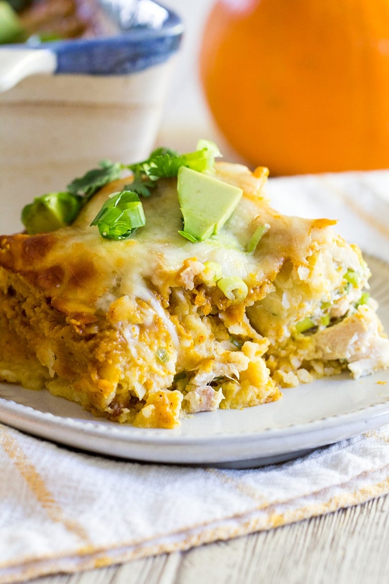 Pumpkin Chicken Enchiladas with a Pumpkin Enchilada Sauce make an easy and delicious family weeknight or weekend dinner perfect for fall. #enchiladas #pumpkin #chickenenchiladas #pumpkinenchiladas #enchiladasauce #glutenfree #glutenfreeenchiladas #pumpkinspice #dinner #weeknightdinner #easydinner #rotisseriechicken