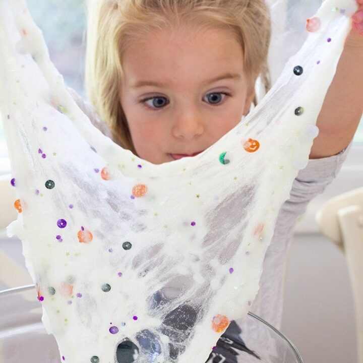 Toddler Safe Halloween Glitter Slime Recipe only has 3 Ingredients and no Borax so it's worry free for kids. Great for sensory play, preschool, or kindergarten classrooms. Mess free and quick to make for ages 3 and up. #Slime #BakingSoda #Glue #ContactLenses #Goo #Solutions #Glitter #Magic #Craft #Kids #KidsCraft #SlimeRecipe #Diy #Activities #KidsStuff