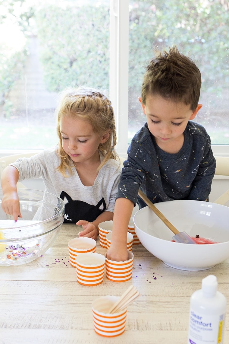 Toddler Safe Halloween Glitter Slime Recipe only has 3 Ingredients and no Borax so it's worry free for kids. Great for sensory play, preschool, or kindergarten classrooms. Mess free and quick to make for ages 3 and up. #Slime #BakingSoda #Glue #ContactLenses #Goo #Solutions #Glitter #Magic #Craft #Kids #KidsCraft #SlimeRecipe #Diy #Activities