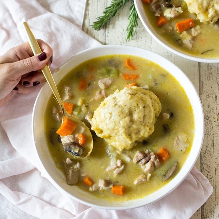 Easy Chicken and Dumplings from Scratch with mushrooms. A creamy chicken and mushroom soup finished with light and fluffy homemade dumplings. This soup recipe is the ultimate comfort food! #chicken #soup #dumplings #mushroomsoup #chickensoup