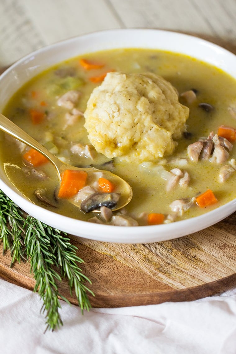 Easy Chicken and Dumplings from Scratch with mushrooms. A creamy chicken and mushroom soup finished with light and fluffy homemade dumplings. This soup recipe is the ultimate comfort food! #chicken #soup #dumplings #mushroomsoup #chickensoup 