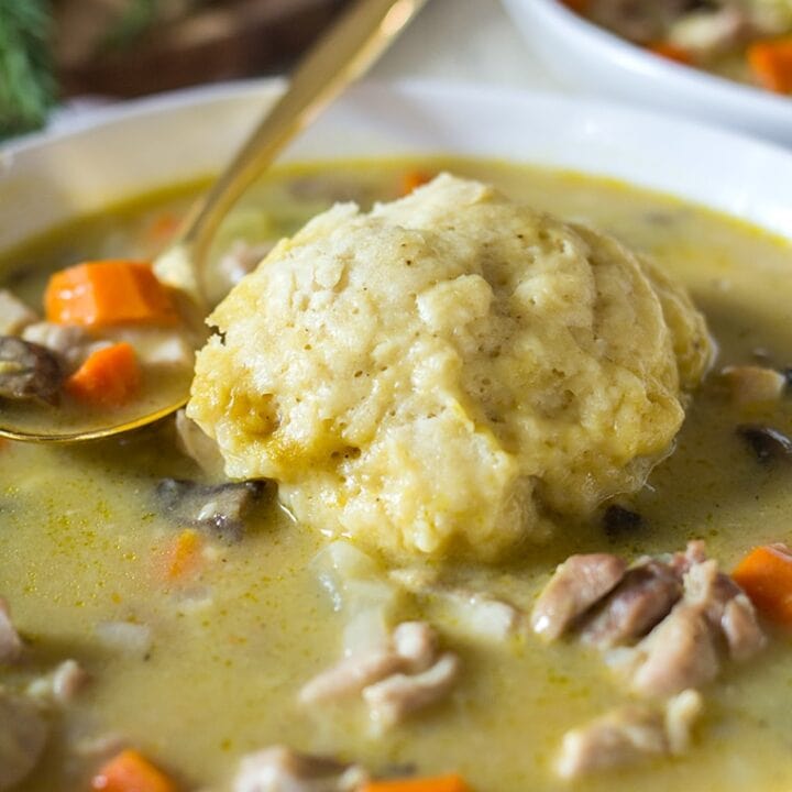 Easy Chicken and Dumplings from Scratch with mushrooms. A creamy chicken and mushroom soup finished with light and fluffy homemade dumplings. This soup recipe is the ultimate comfort food! #chicken #soup #dumplings #mushroomsoup #chickensoup