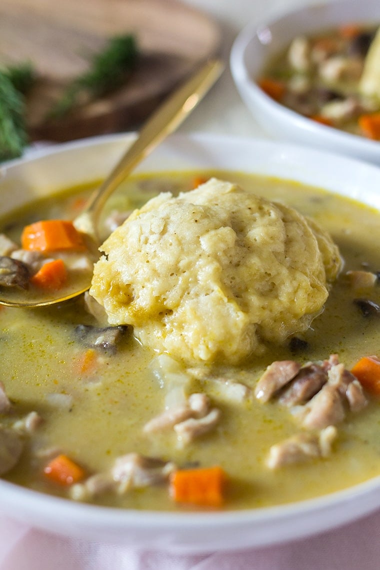 Easy Chicken and Dumplings from Scratch with mushrooms. A creamy chicken and mushroom soup finished with light and fluffy homemade dumplings. This soup recipe is the ultimate comfort food! #chicken #soup #dumplings #mushroomsoup #chickensoup 