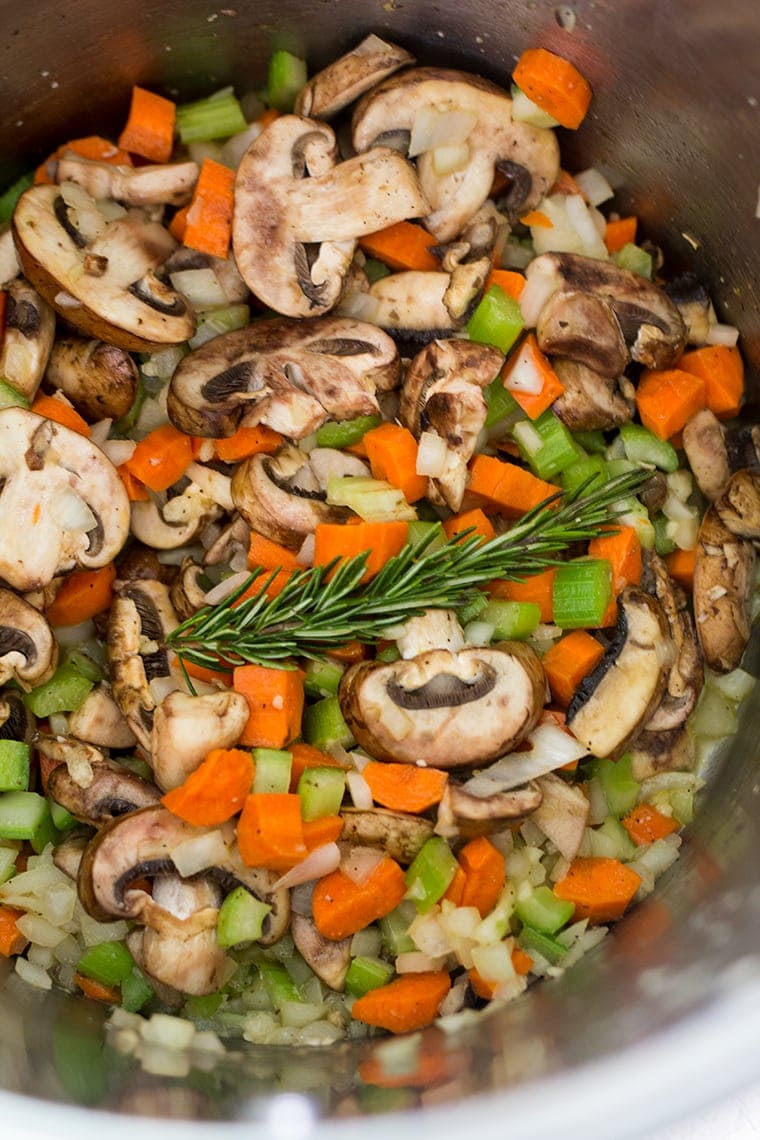 Easy Chicken and Dumplings from Scratch with mushrooms. A creamy chicken and mushroom soup finished with light and fluffy homemade dumplings. This soup recipe is the ultimate comfort food! #chicken #soup #dumplings #mushroomsoup #chickensoup 