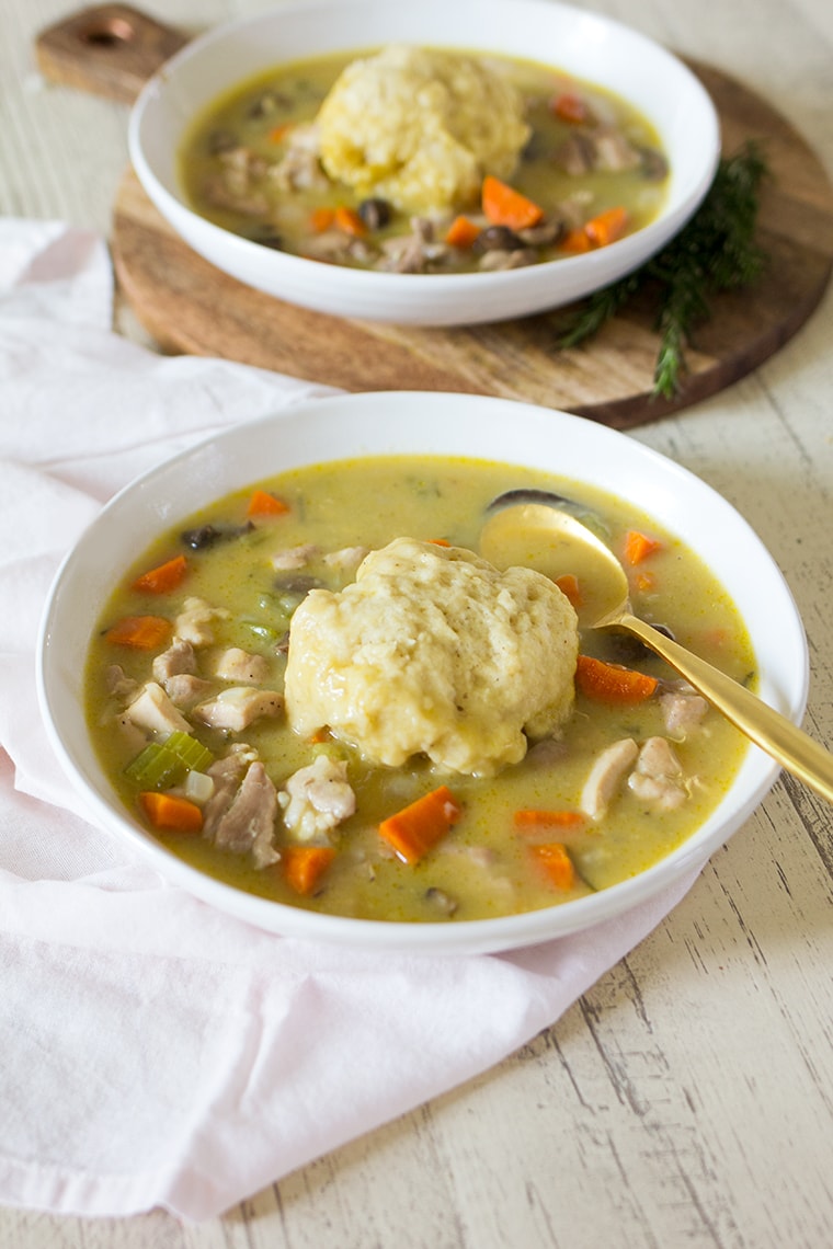 Easy Chicken and Dumplings from Scratch with mushrooms. A creamy chicken and mushroom soup finished with light and fluffy homemade dumplings. This soup recipe is the ultimate comfort food! #chicken #soup #dumplings #mushroomsoup #chickensoup 