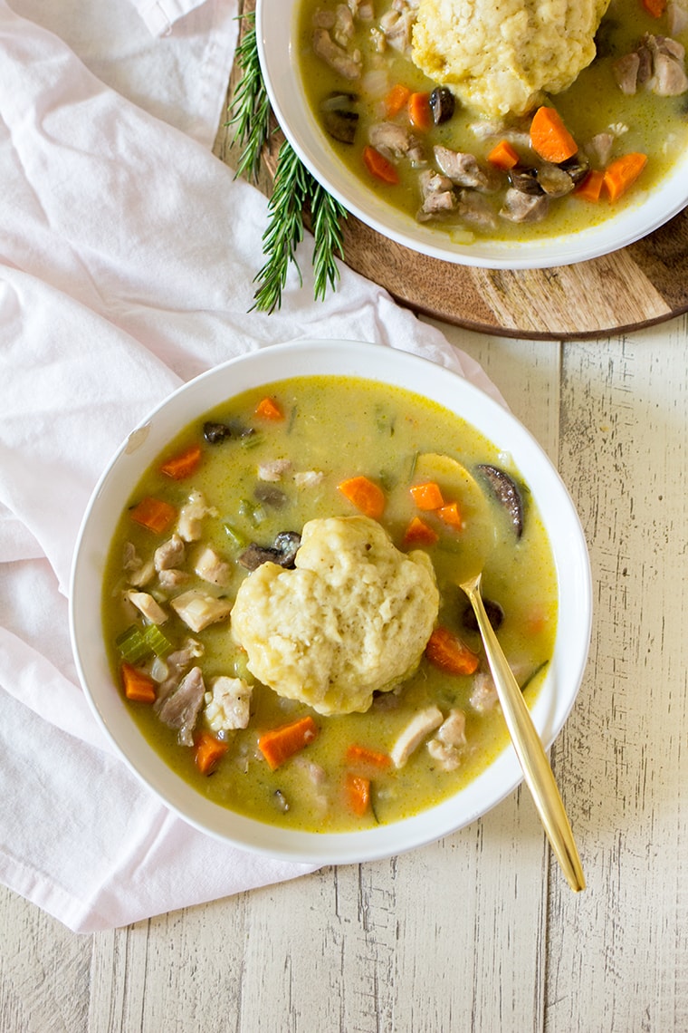 Easy Chicken and Dumplings from Scratch with mushrooms. A creamy chicken and mushroom soup finished with light and fluffy homemade dumplings. This soup recipe is the ultimate comfort food! #chicken #soup #dumplings #mushroomsoup #chickensoup 