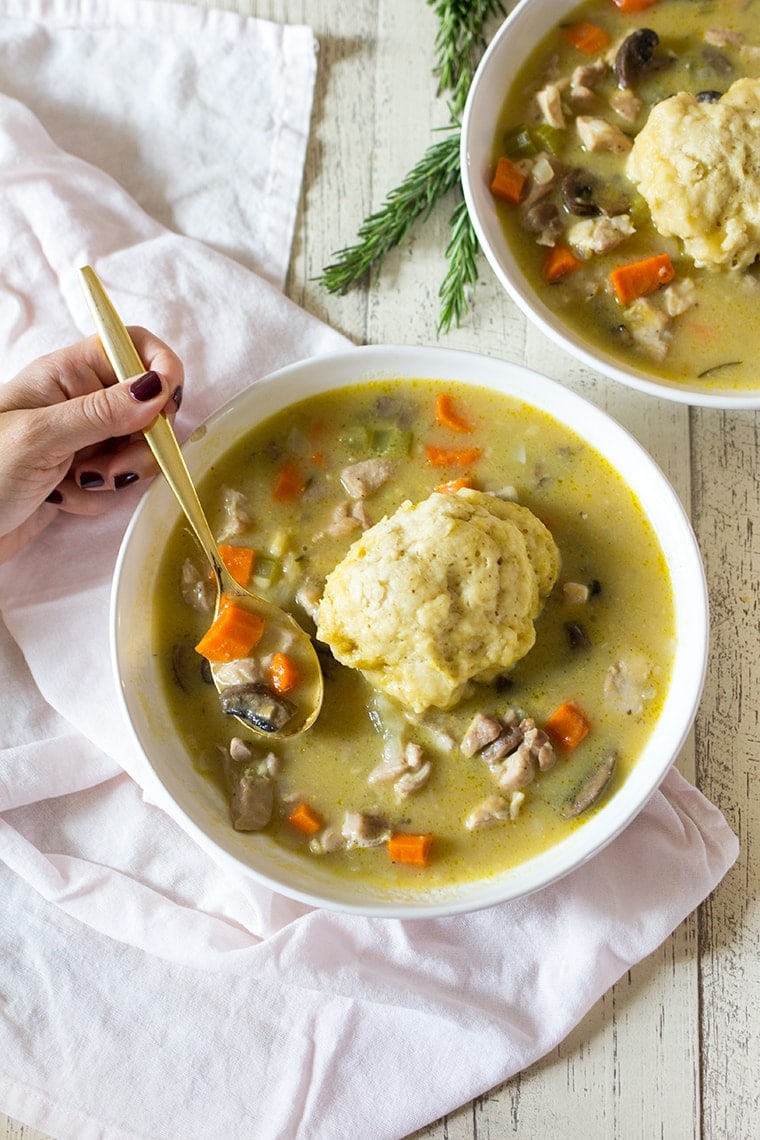 Easy Chicken and Dumplings from Scratch with mushrooms. A creamy chicken and mushroom soup finished with light and fluffy homemade dumplings. This soup recipe is the ultimate comfort food! #chicken #soup #dumplings #mushroomsoup #chickensoup