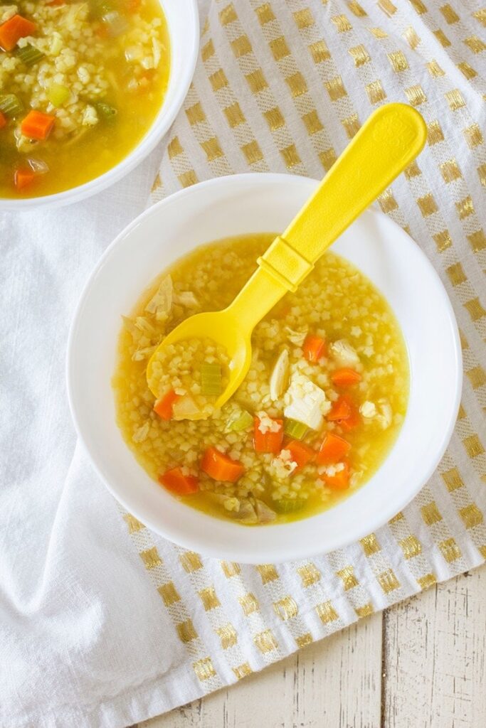Homemade Chicken and Stars Soup is the perfect toddler meal for lunch or dinner. It's fast to make thanks to store bought rotisserie chicken and delicious to eat.  #kidfriendly #chickenandstars #soup #chickennoodle #chickensoup #rotisserie #dinner #toddlermeal #starsoup #starpasta #pasta 