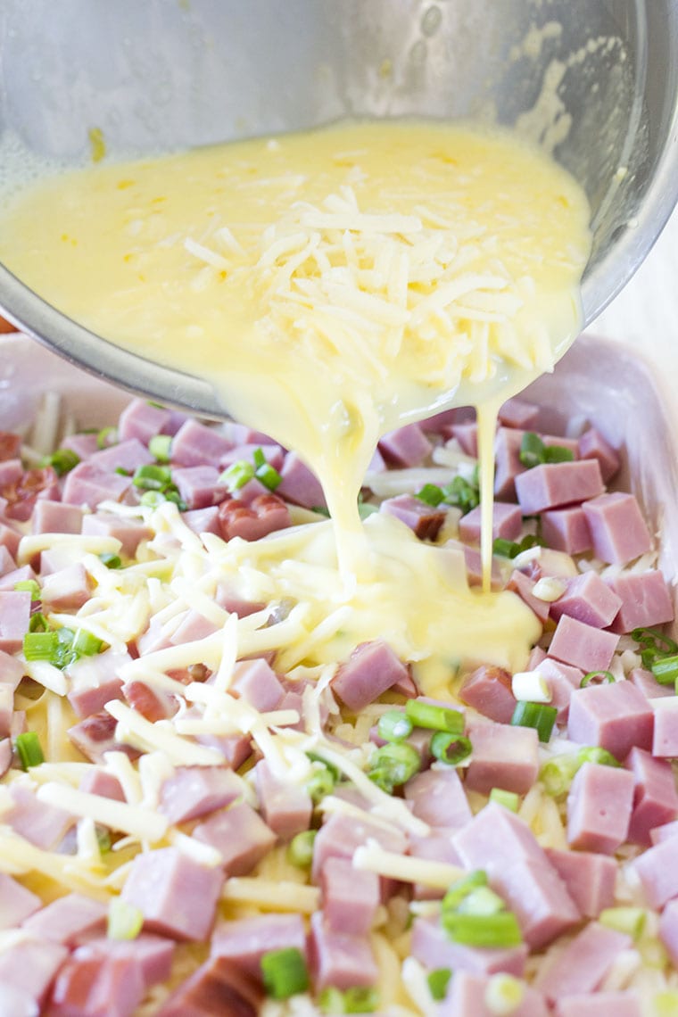 Valentine's Day Ham and Cheese Breakfast Casserole is the perfect way to show your family you love them on Valentine's Day morning. This egg, cheese, ham and potato casserole will fill their bellies and their hearts! #casserole #breakfast #breakfastcasserole #eggcasserole #potato #ham #valentinesday