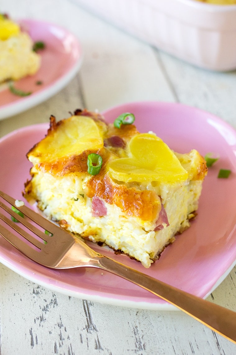 Valentine's Day Ham and Cheese Breakfast Casserole is the perfect way to show your family you love them on Valentine's Day morning. This egg, cheese, ham and potato casserole will fill their bellies and their hearts! #casserole #breakfast #breakfastcasserole #eggcasserole #potato #ham #valentinesday
