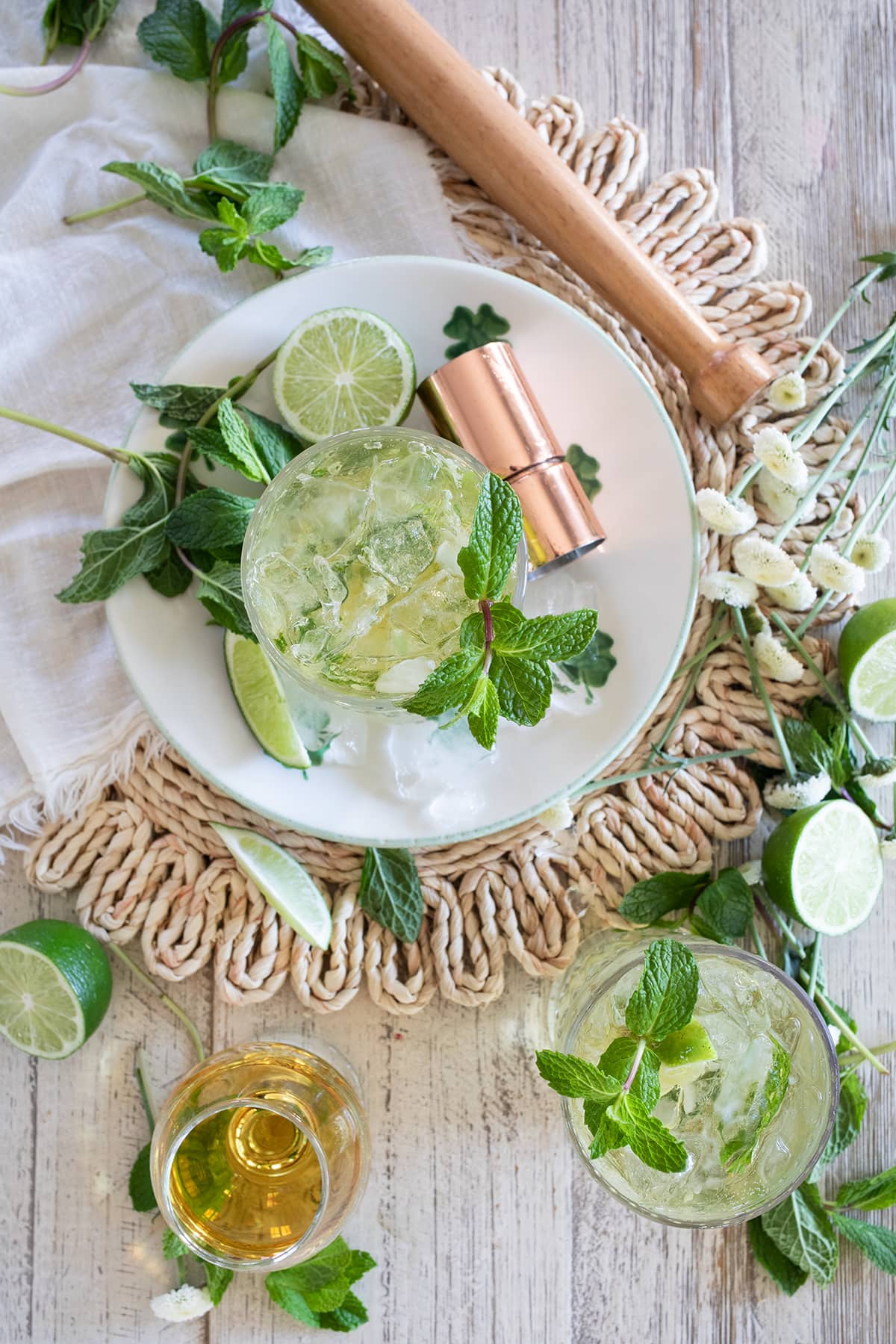 Irish Mint Mojitos are the perfect St. Patrick's Day cocktail made with Irish Whiskey, Mint Simple Syrup, muddled mint and limes and topped with club soda. #stpatricksday #mojito #whiskeycocktail #irishmojito