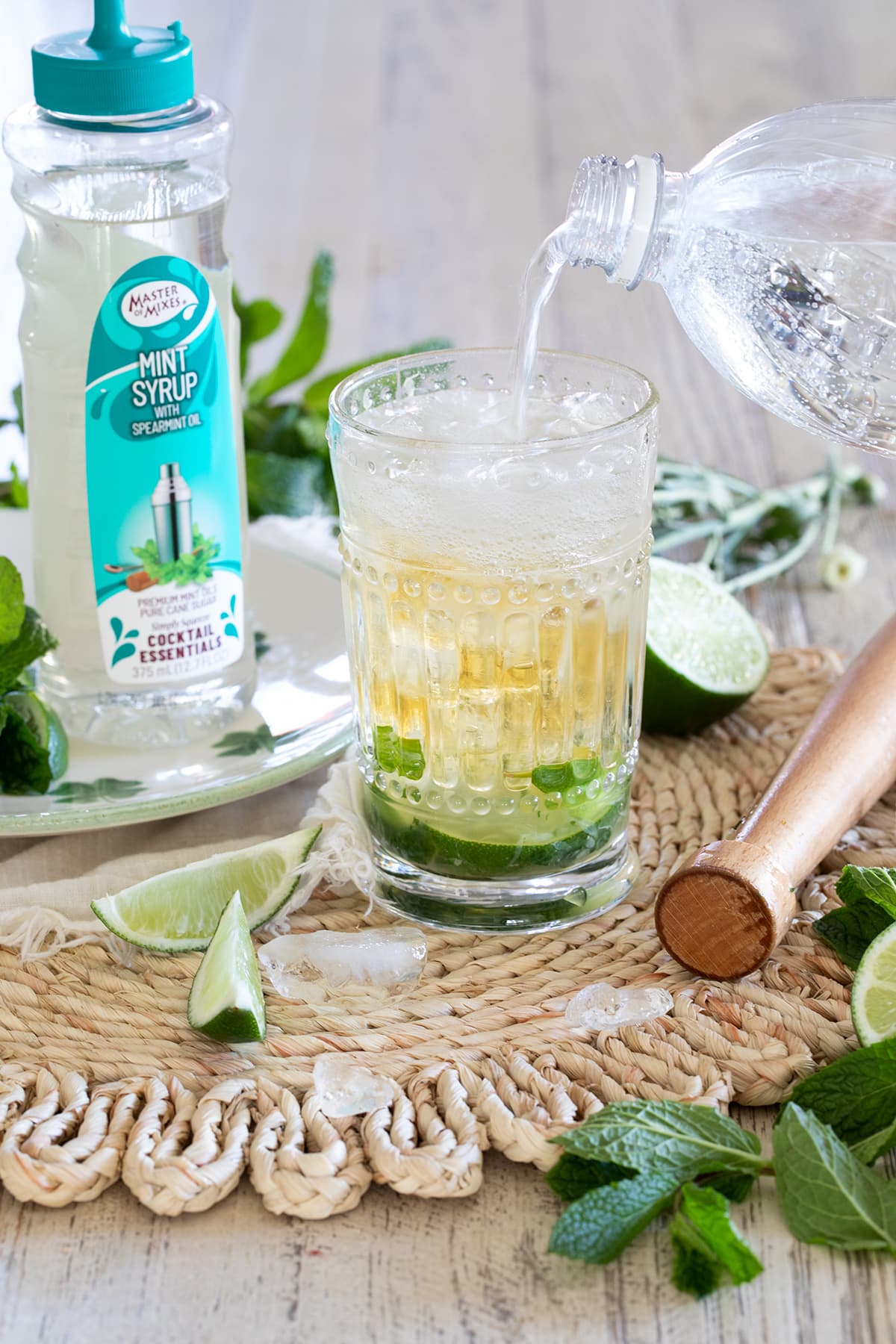 Irish Mint Mojitos are the perfect St. Patrick's Day cocktail made with Irish Whiskey, Mint Simple Syrup, muddled mint and limes and topped with club soda. #stpatricksday #mojito #whiskeycocktail #irishmojito