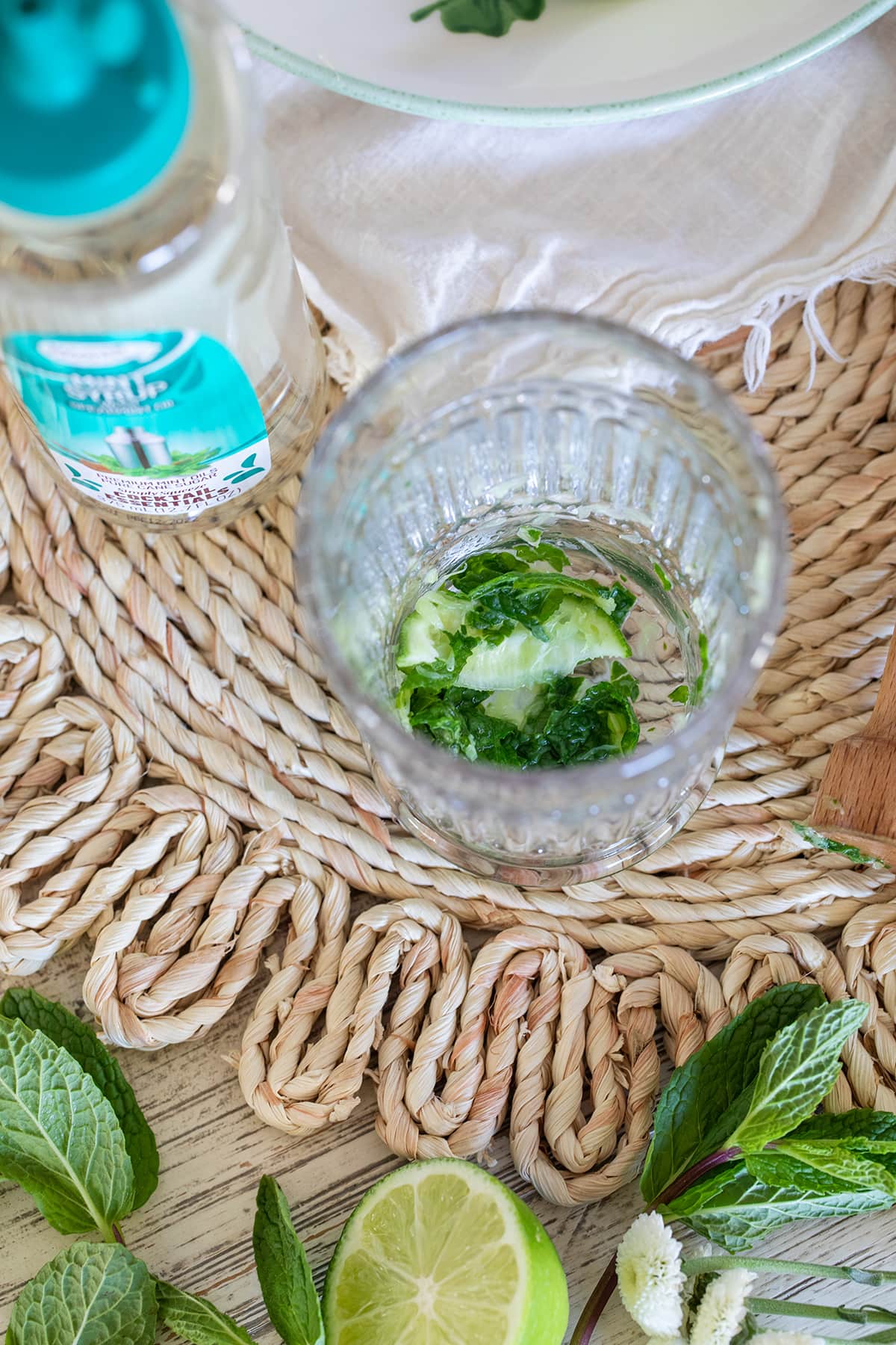 Irish Mint Mojitos are the perfect St. Patrick's Day cocktail made with Irish Whiskey, Mint Simple Syrup, muddled mint and limes and topped with club soda. #stpatricksday #mojito #whiskeycocktail #irishmojito