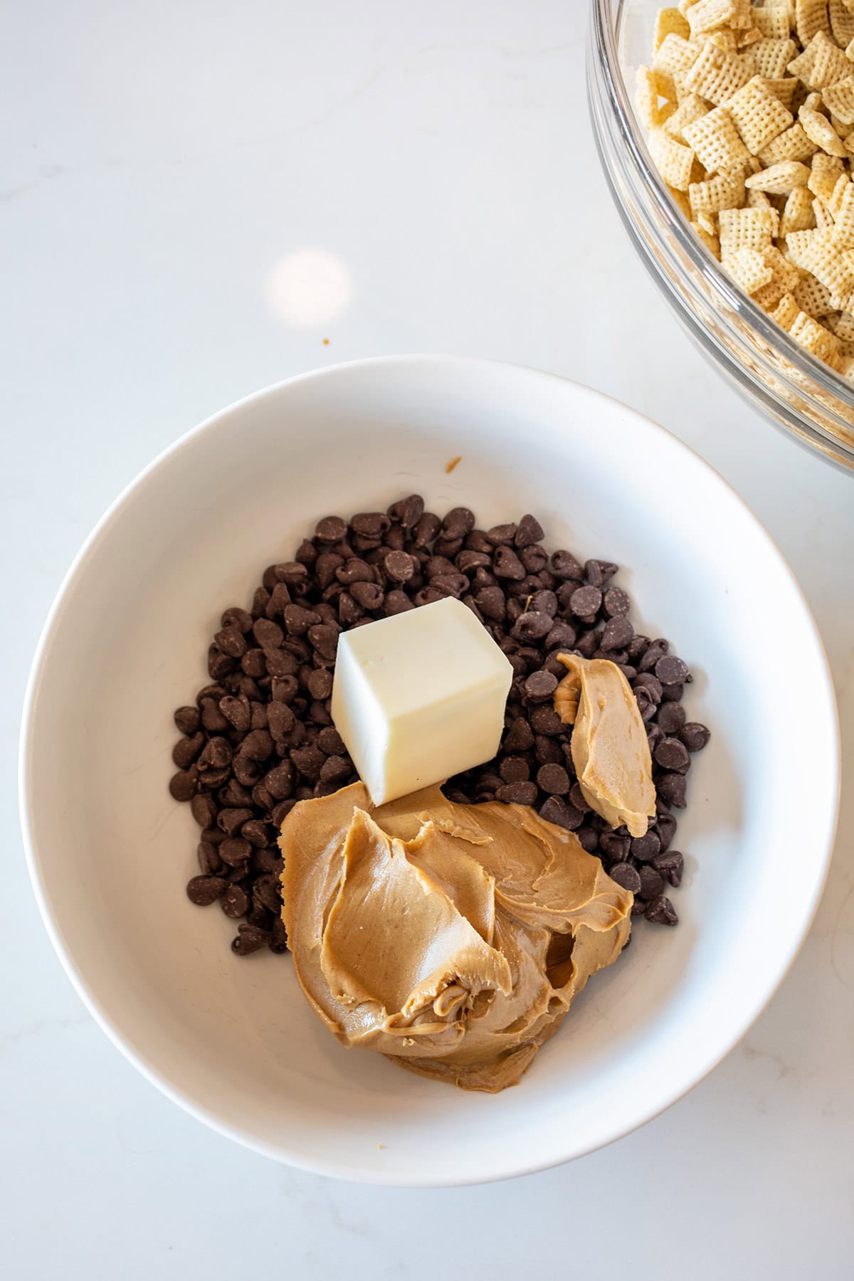Chocolate chips, butter and peanut butter to melt for Muddy Buddies