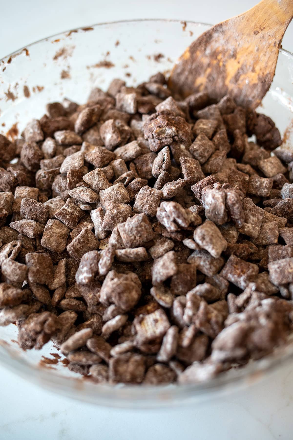 Muddy Buddies Mix in a glass bowl.